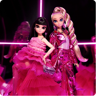 Two dolls in pink dresses